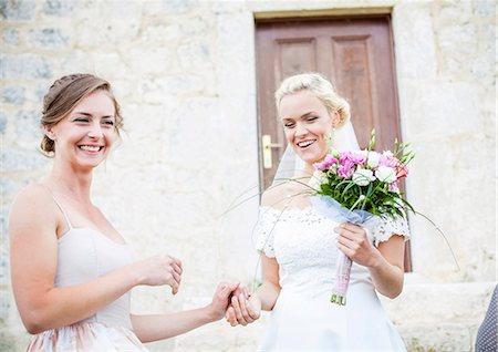 simsearch:6115-08239477,k - Happy bride and girlfriend holding hands Stock Photo - Premium Royalty-Free, Code: 6115-08239372