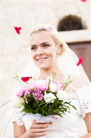 simsearch:6115-07109837,k - Portrait of bride holding bouquet Stock Photo - Premium Royalty-Free, Code: 6115-08239395