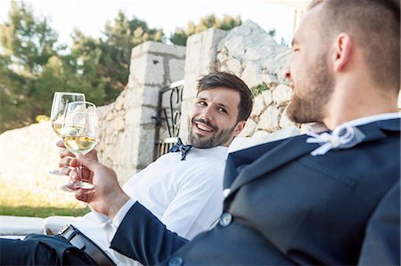 simsearch:6115-08239477,k - Groom and friend drinking champagne on wedding party Stock Photo - Premium Royalty-Free, Code: 6115-08239472