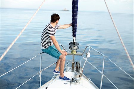 sailing music - Man listening to music on sailboat, Adriatic Sea Stock Photo - Premium Royalty-Free, Code: 6115-08239797