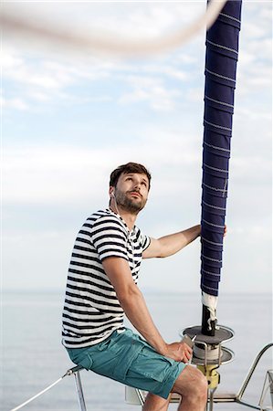 sailing music - Man listening to music on sailboat, Adriatic Sea Stock Photo - Premium Royalty-Free, Code: 6115-08239796