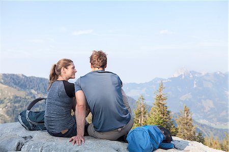 simsearch:6115-08239587,k - Young couple resting on mountain peak Photographie de stock - Premium Libres de Droits, Code: 6115-08239848