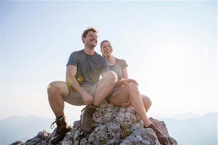 simsearch:640-02947685,k - Young couple resting on mountain peak Stock Photo - Premium Royalty-Free, Code: 6115-08239861