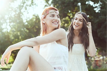 simsearch:6115-08239929,k - Young women in hippie style fashion laughing Stock Photo - Premium Royalty-Free, Code: 6115-08239904