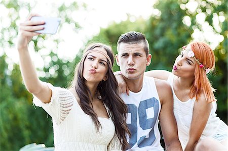 pouting for taking pictures - Young people in hippie style fashion taking self portrait Stock Photo - Premium Royalty-Free, Code: 6115-08239909