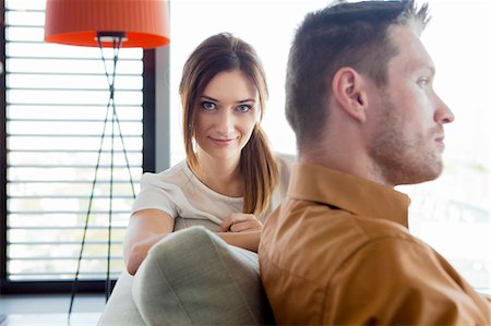 Couple relaxing in modern apartment Stock Photo - Premium Royalty-Free, Code: 6115-08416179