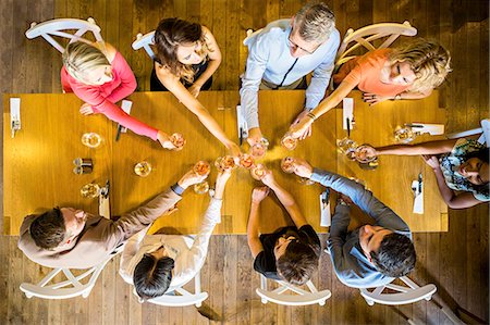 simsearch:6115-08416263,k - Group of friends on dinner party in restaurant Stock Photo - Premium Royalty-Free, Code: 6115-08416262