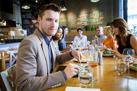 simsearch:6115-08416263,k - Group of friends celebrating in restaurant Stock Photo - Premium Royalty-Free, Code: 6115-08416275