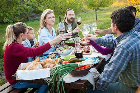 simsearch:6115-08416361,k - Group of friends drinking wine on garden party Stock Photo - Premium Royalty-Free, Code: 6115-08416369