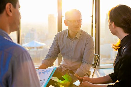 Meeting of architects and business people in modern office Stock Photo - Premium Royalty-Free, Code: 6115-08416327