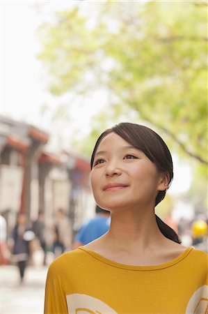 simsearch:6116-07235632,k - Young Woman smiling looking away Stock Photo - Premium Royalty-Free, Code: 6116-06938570