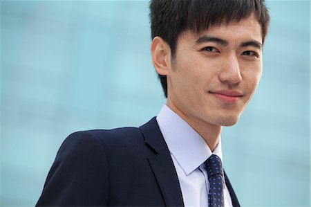 simsearch:6116-06939218,k - Close-up portrait of young businessman, China Fotografie stock - Premium Royalty-Free, Codice: 6116-06938503