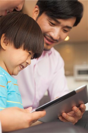 simsearch:696-03401226,k - Son and his parents using digital tablet Stock Photo - Premium Royalty-Free, Code: 6116-06938665