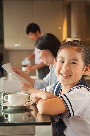 family breakfast kitchen table - Family eating breakfast Stock Photo - Premium Royalty-Free, Code: 6116-06938681