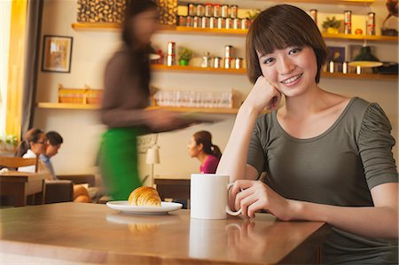 simsearch:649-08145347,k - Portrait of young woman at a coffee shop, Beijing Stock Photo - Premium Royalty-Free, Code: 6116-06938604