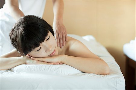 simsearch:851-02963682,k - Young Woman Receiving Massage Stock Photo - Premium Royalty-Free, Code: 6116-06938788