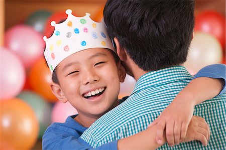 paper family - Birthday Boy Hugging His Father Stock Photo - Premium Royalty-Free, Code: 6116-06938729