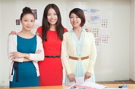 simsearch:6116-07086722,k - Portrait of Smiling Businesswomen in Office Stock Photo - Premium Royalty-Free, Code: 6116-06938867