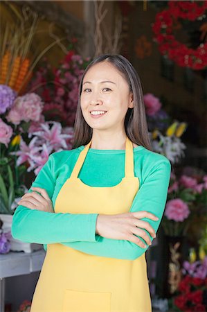 florists aprons - Portrait Of Mature Woman In Flower Shop Foto de stock - Sin royalties Premium, Código: 6116-06938956