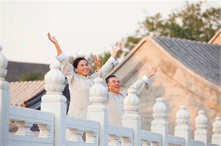 simsearch:6116-07235528,k - Two seniors practicing Taijiquan in Beijing, Arms outstretched Stock Photo - Premium Royalty-Free, Code: 6116-06938974