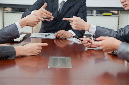 simsearch:6113-08521456,k - Businesspeople Making Gestures During Business Meeting Stock Photo - Premium Royalty-Free, Code: 6116-06939151