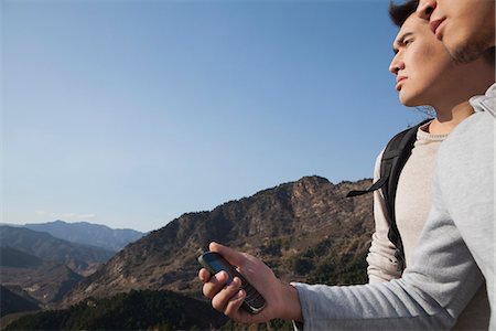 Men hiking and using GPS Stock Photo - Premium Royalty-Free, Code: 6116-06939176