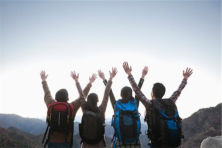 simsearch:6116-06939194,k - Group of people standing with hands outstretched Photographie de stock - Premium Libres de Droits, Code: 6116-06939193