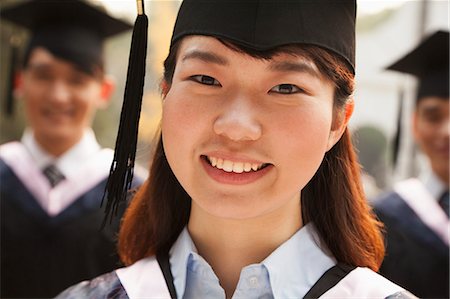 simsearch:6116-06939099,k - Young Graduates in Cap and Gown Stock Photo - Premium Royalty-Free, Code: 6116-06939196