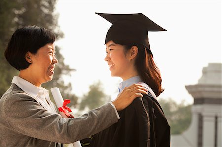 daughter talking to mother - Proud Mother of a Graduate Stock Photo - Premium Royalty-Free, Code: 6116-06939208