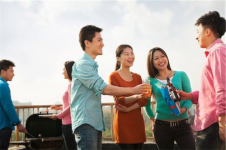 simsearch:6116-06939237,k - Group of Friends Having a Barbeque on a Rooftop Stock Photo - Premium Royalty-Free, Code: 6116-06939229