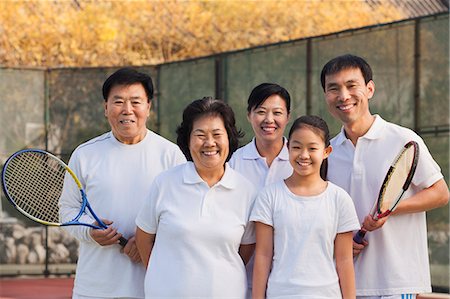 senior asian woman tennis - Family playing tennis, portrait Stock Photo - Premium Royalty-Free, Code: 6116-06939308