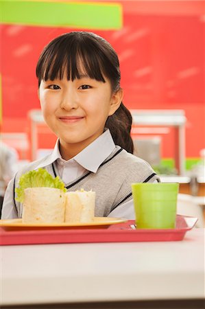 simsearch:6116-06939469,k - School girl portrait in school cafeteria Foto de stock - Royalty Free Premium, Número: 6116-06939457