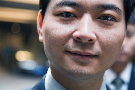 portrait business head and shoulders - Portrait of man in a parking garage, close-up, Beijing Stock Photo - Premium Royalty-Free, Code: 6116-06939409
