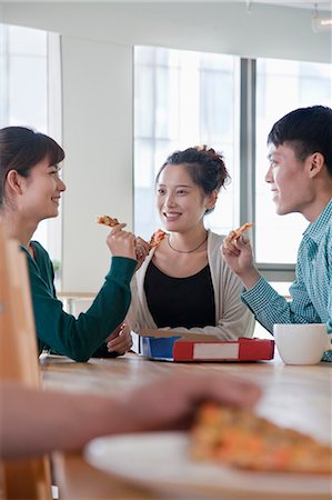 four hand joined - Lunch break in the office Stock Photo - Premium Royalty-Free, Code: 6116-06939508