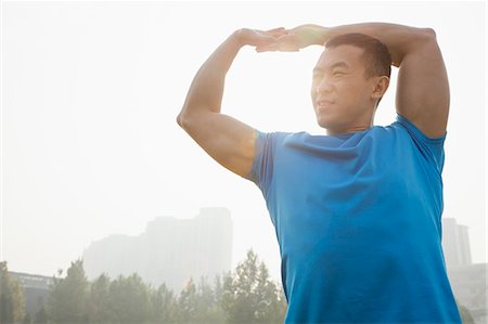 stretching - Young Muscular Man Stretching Stockbilder - Premium RF Lizenzfrei, Bildnummer: 6116-07084554