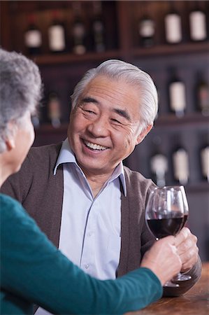 simsearch:6116-07235662,k - Senior Couple Toasting and Enjoying Themselves Drinking Wine, Focus on Male Stock Photo - Premium Royalty-Free, Code: 6116-07084740