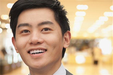 suit business man close up face one person only - Portrait of young businessman close-up, Beijing Stock Photo - Premium Royalty-Free, Code: 6116-07084753