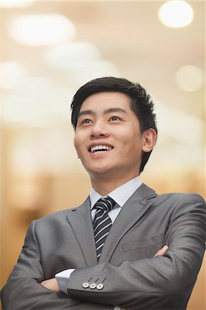 simsearch:6116-07086540,k - Portrait of young businessman with arms crossed Stock Photo - Premium Royalty-Free, Code: 6116-07084750