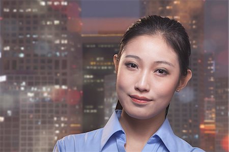 simsearch:6116-07086388,k - Portrait of young smiling businesswoman, cityscape of Beijing in background Stock Photo - Premium Royalty-Free, Code: 6116-07084768