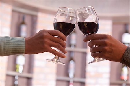 Close Up of Couple Toasting, Hands and Wineglass only Stock Photo - Premium Royalty-Free, Code: 6116-07084732