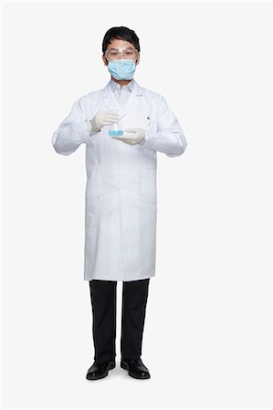 scientist white coat full body - Scientist Holding Beaker Stock Photo - Premium Royalty-Free, Code: 6116-07084997