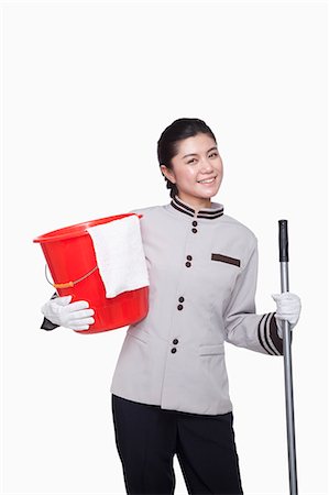 eimer - Young female caretaker with bucket and mop, studio shot Stockbilder - Premium RF Lizenzfrei, Bildnummer: 6116-07084903