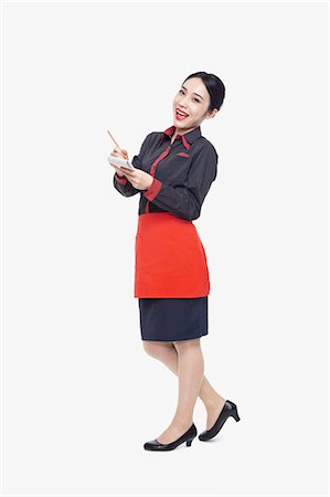 simsearch:6109-08801971,k - Young waitress taking an order, studio shot Photographie de stock - Premium Libres de Droits, Code: 6116-07084900