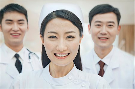 simsearch:6116-07084897,k - Portrait of Healthcare workers in China, Two Doctors and Nurse Fotografie stock - Premium Royalty-Free, Codice: 6116-07084919