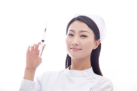 simsearch:6116-07084926,k - Portrait of Nurse Holding a Syringe Stockbilder - Premium RF Lizenzfrei, Bildnummer: 6116-07084931