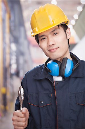 simsearch:6116-07084897,k - Portrait of Young Engineer Fotografie stock - Premium Royalty-Free, Codice: 6116-07085065