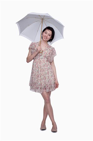 sombrilla - Young woman standing with umbrella Foto de stock - Sin royalties Premium, Código: 6116-07085127