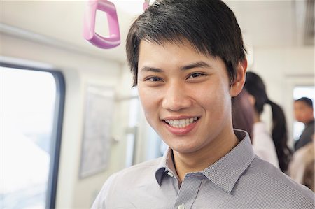 Young man in subway Stock Photo - Premium Royalty-Free, Code: 6116-07085133