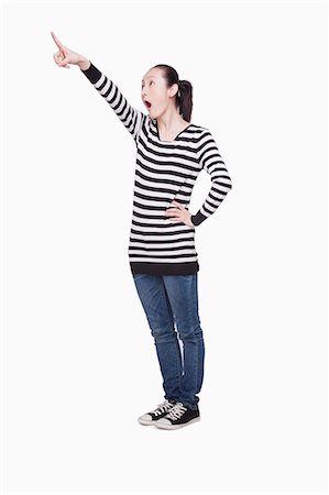 simsearch:6116-07084961,k - Young Woman Pointing Foto de stock - Sin royalties Premium, Código: 6116-07085250