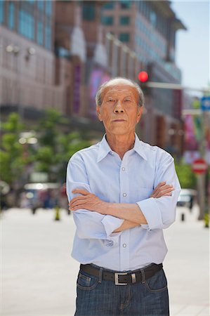 simsearch:6116-07236502,k - Portrait of senior man, arms crossed, outdoors in Beijing Stock Photo - Premium Royalty-Free, Code: 6116-07085267